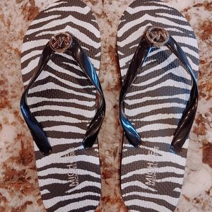 Michael Kors Black and white zebra flip flops